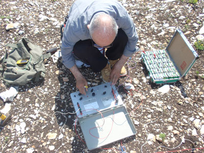 Geophysicist Voja Samolov analyzes data with the measuring instrument on the location antenna pole Tupižnica